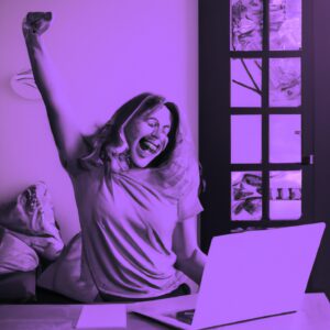 a happy woman in front of a laptop