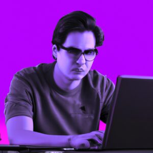 a programmer man in front of a laptop