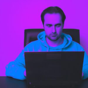 a programmer man in front of a laptop