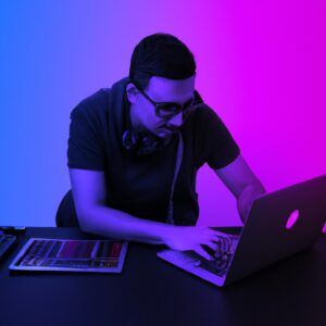 a programmer man in front of a laptop